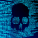 Computer Code On A Screen With A Skull Representing A Computer Virus Malware Attack