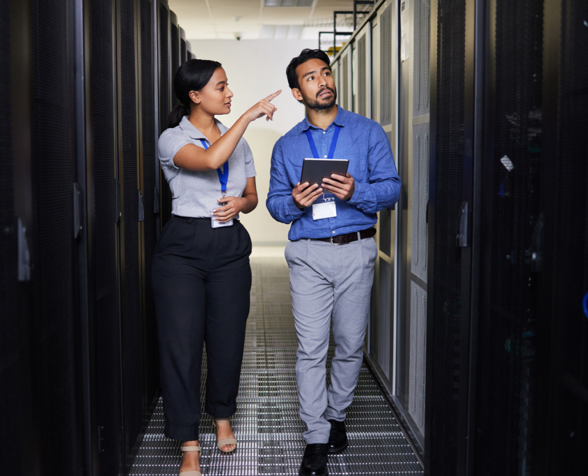 Front View Of Two It Professionals Walking