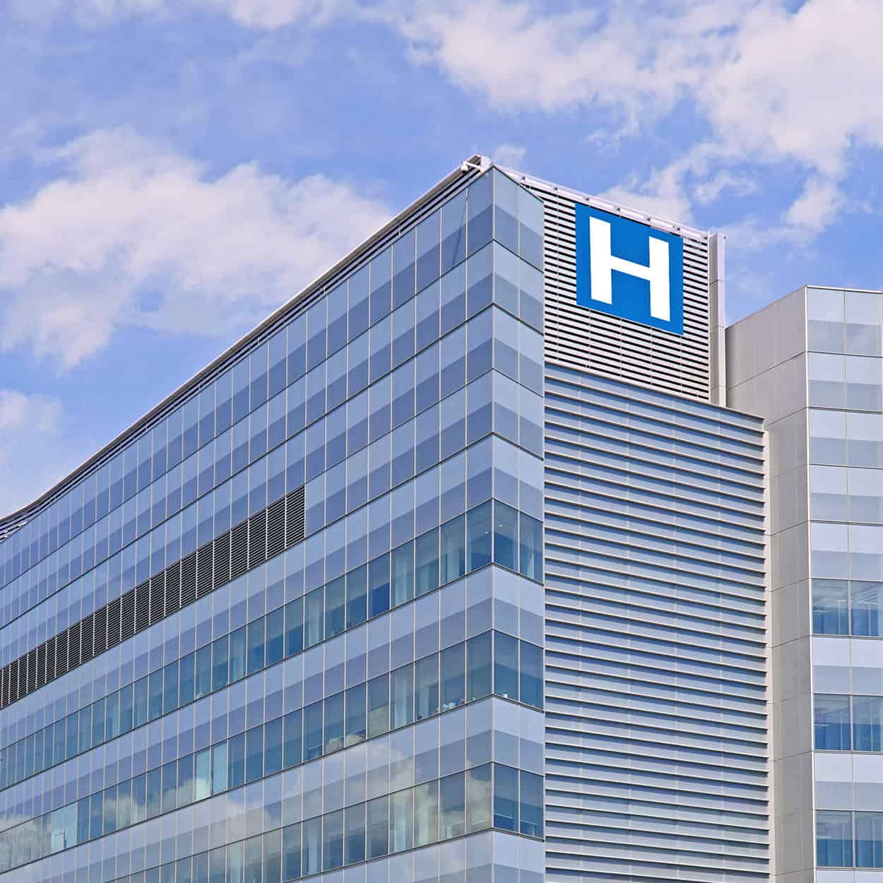 Header Building With Large H Sign For Hospital