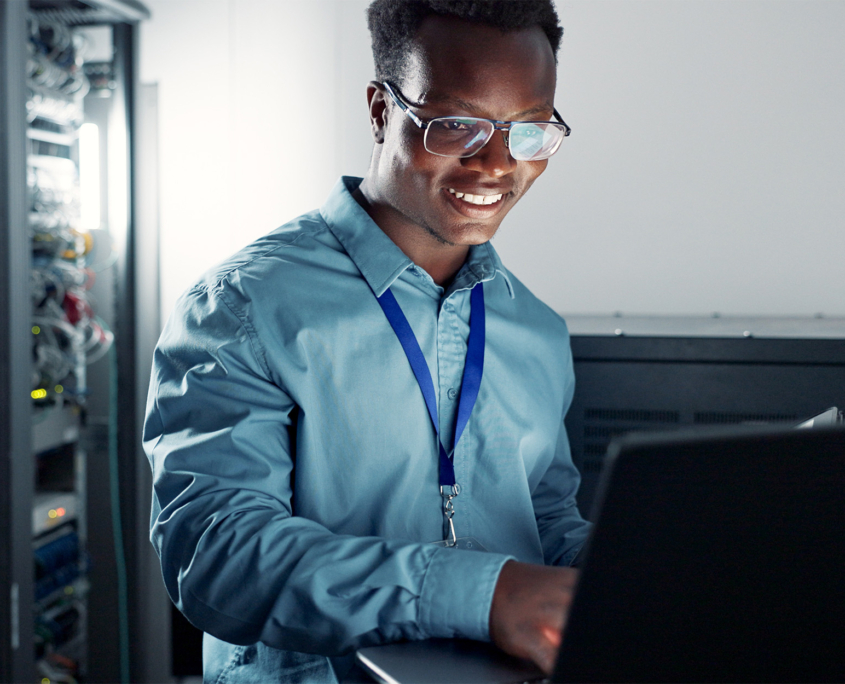 Side View Of A Man Working On Laptop