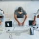 Call center, computer and top view with business people in office for communication